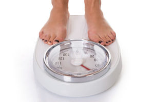 Person standing on a scale.
