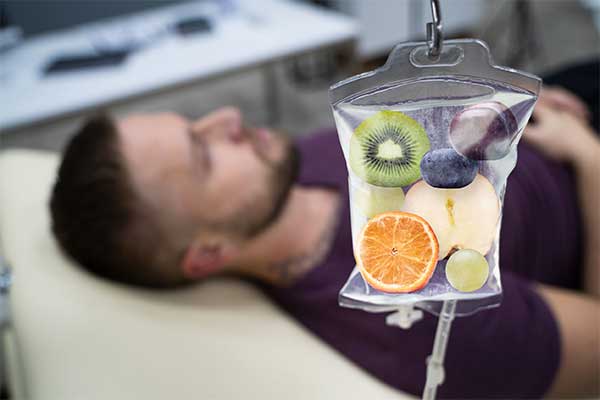 Man getting an IV therapy treatment.